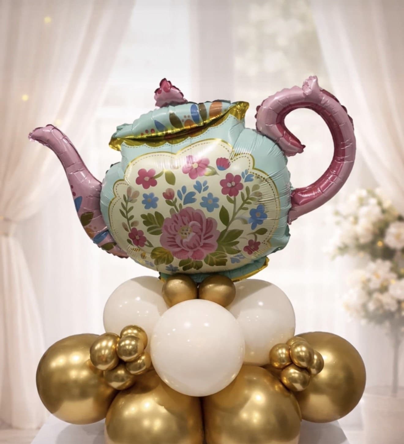 Hand-crafted balloon teapot arrangement by Simply Elevated Balloons